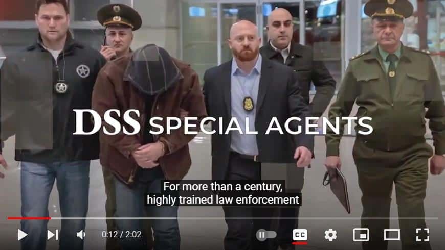 Screenshot of "DSS Special Agents" video showing a group of DSS Special Agents making an arrest.