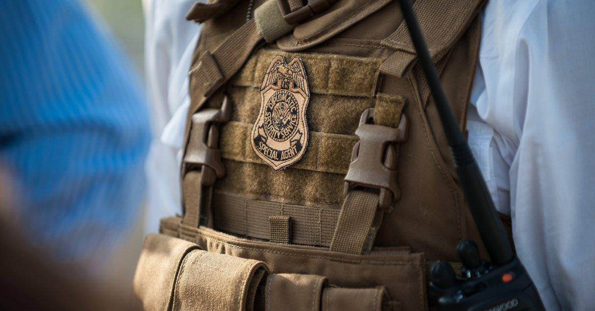 Photo of Diplomatic Security Agent's badge and vest.